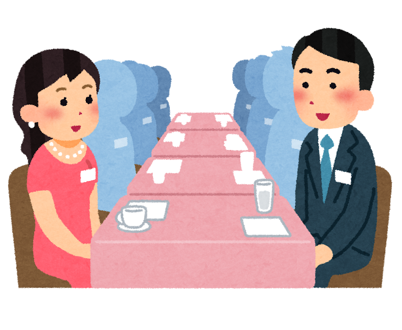 婚活パーティーで会話する男女